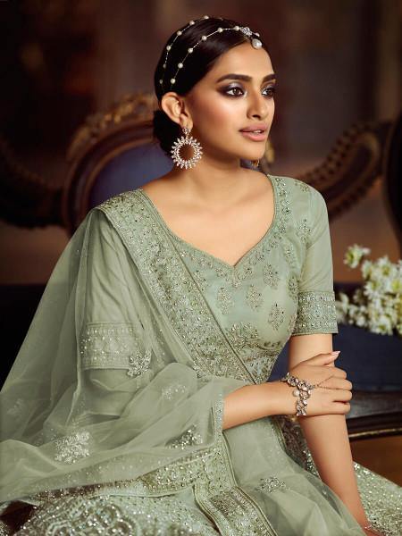 Green Soft Net Heavy Embroidered Lehenga