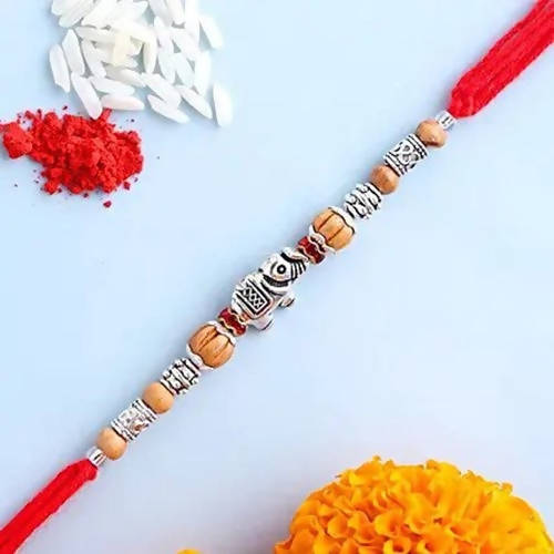 Feng Shui Rakhi With Besan Laddoo & Cashew Jar